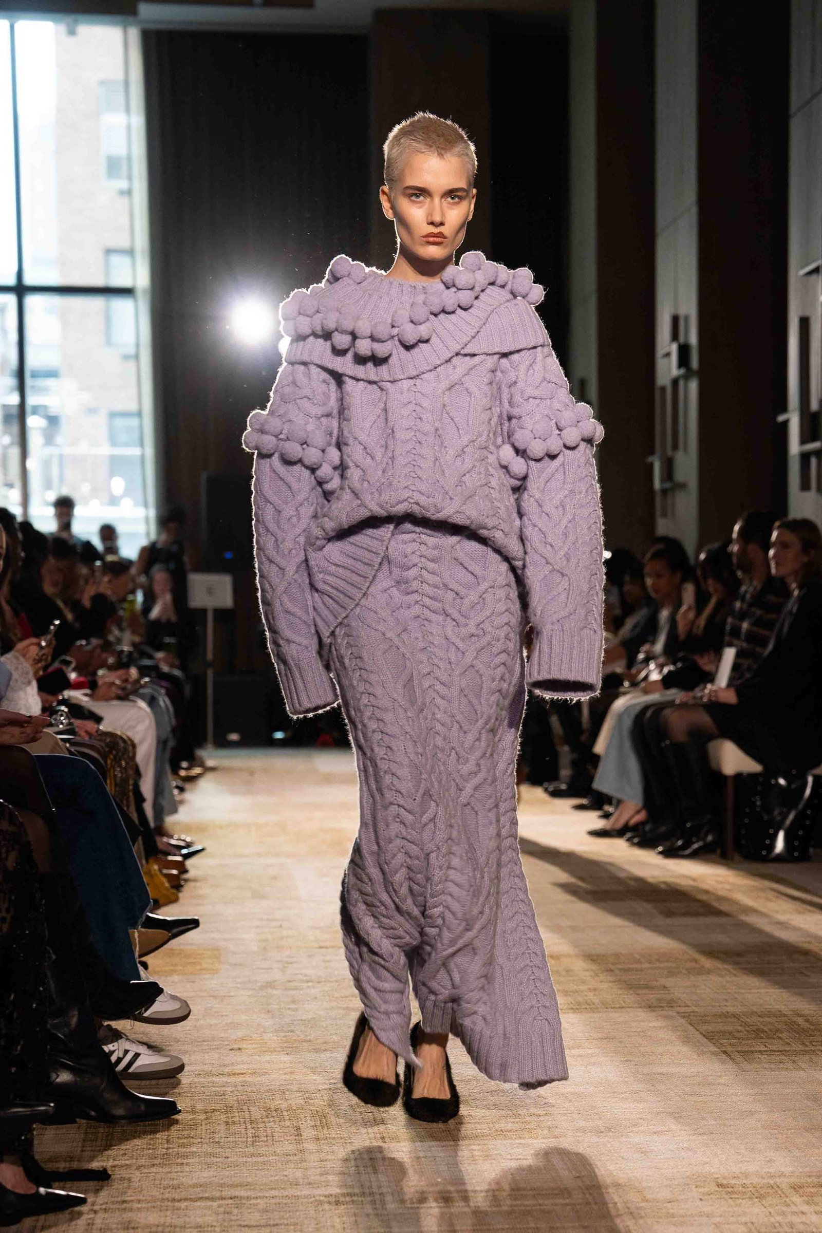 Aknvas runway model in purple outfit New York Fashion Week